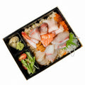 Plated seafood dish with garnishes on a wooden table